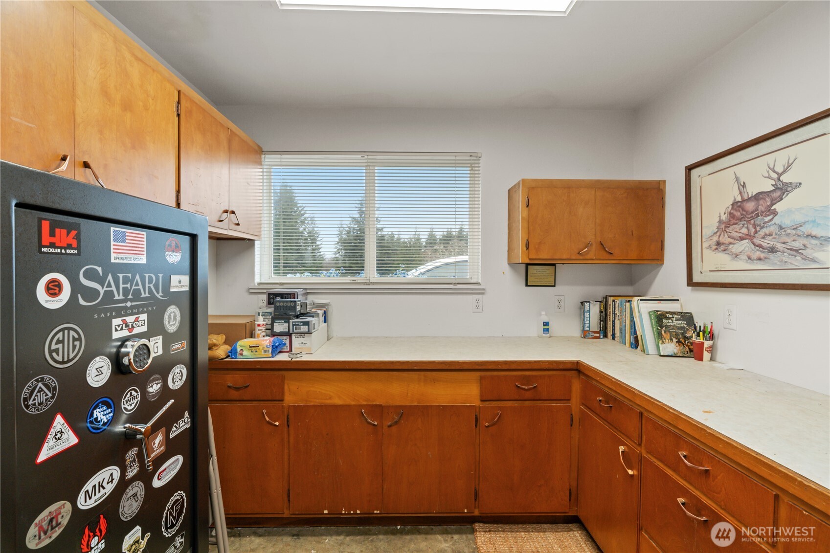 245 Joe Rocky Road Raymond, WA 98577 - Photo 26 of 40 a kitchen with stainless steel appliances granite countertop a sink and a microwave