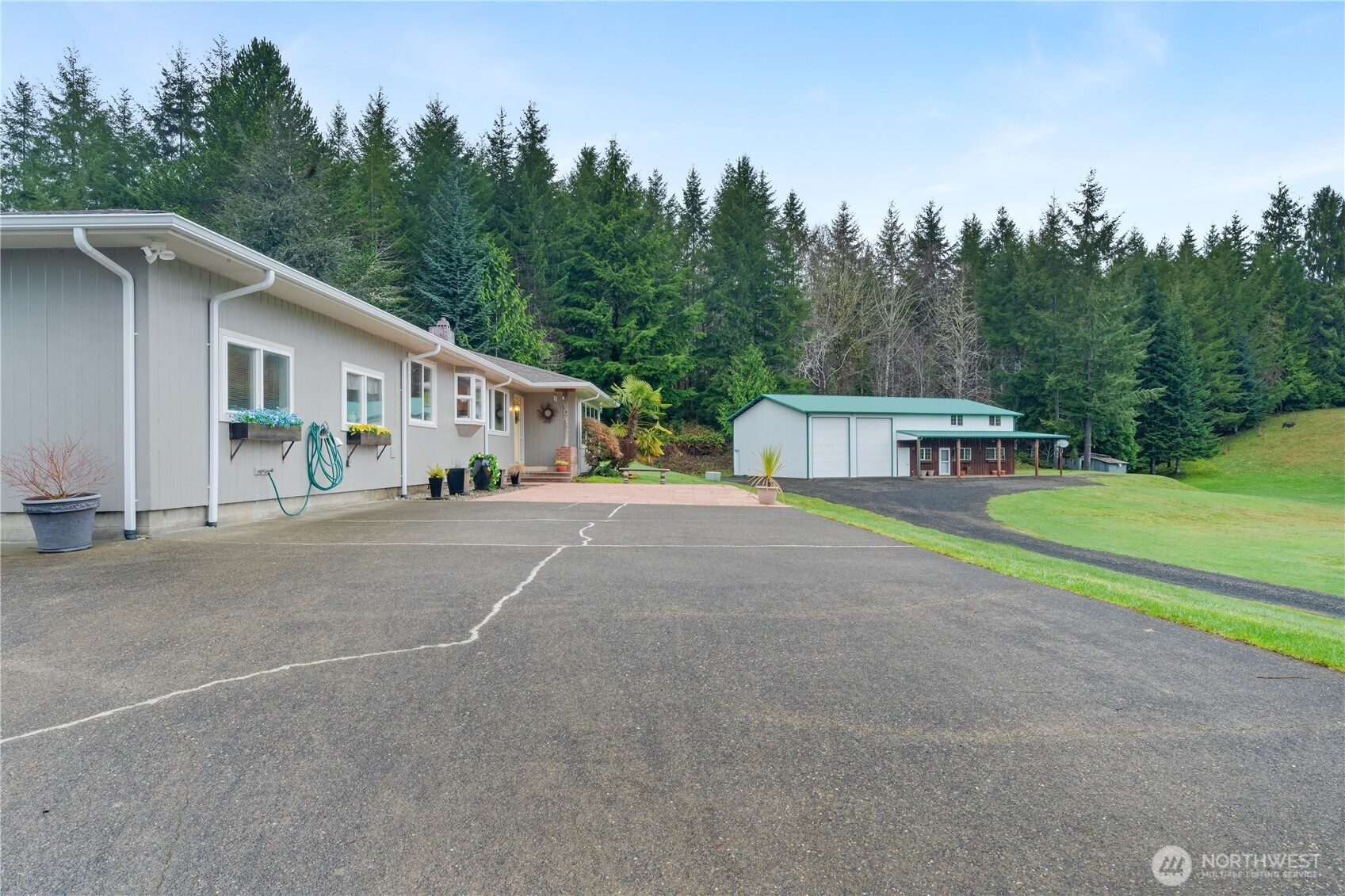 245 Joe Rocky Road Raymond, WA 98577 - Photo 36 of 40 a view of a house with backyard and trees
