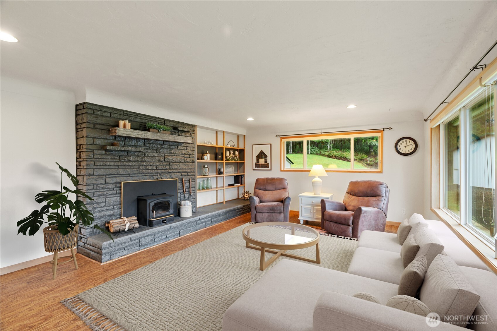245 Joe Rocky Road Raymond, WA 98577 - Photo 4 of 40 a living room with furniture and a fireplace