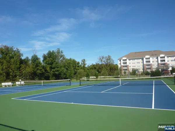 a room with pool table and windows