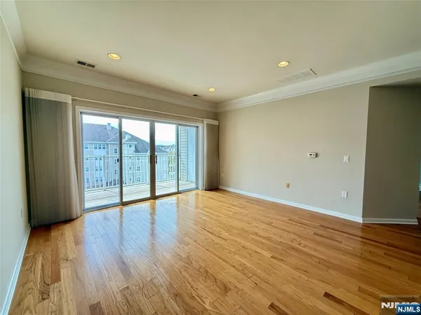 an empty room with a empty space and windows