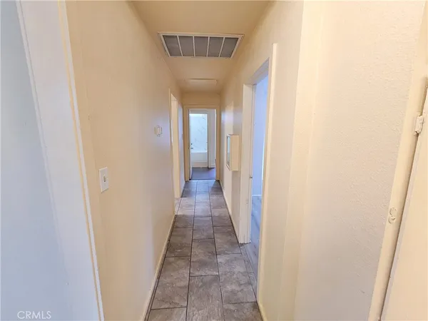 a view of a hallway with a wooden floor