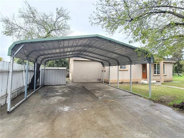 a view of a car garage under an umbrella