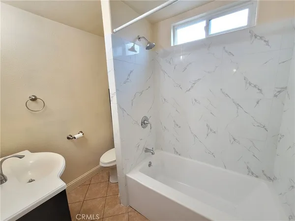 a bathroom with a bath tub and a shower