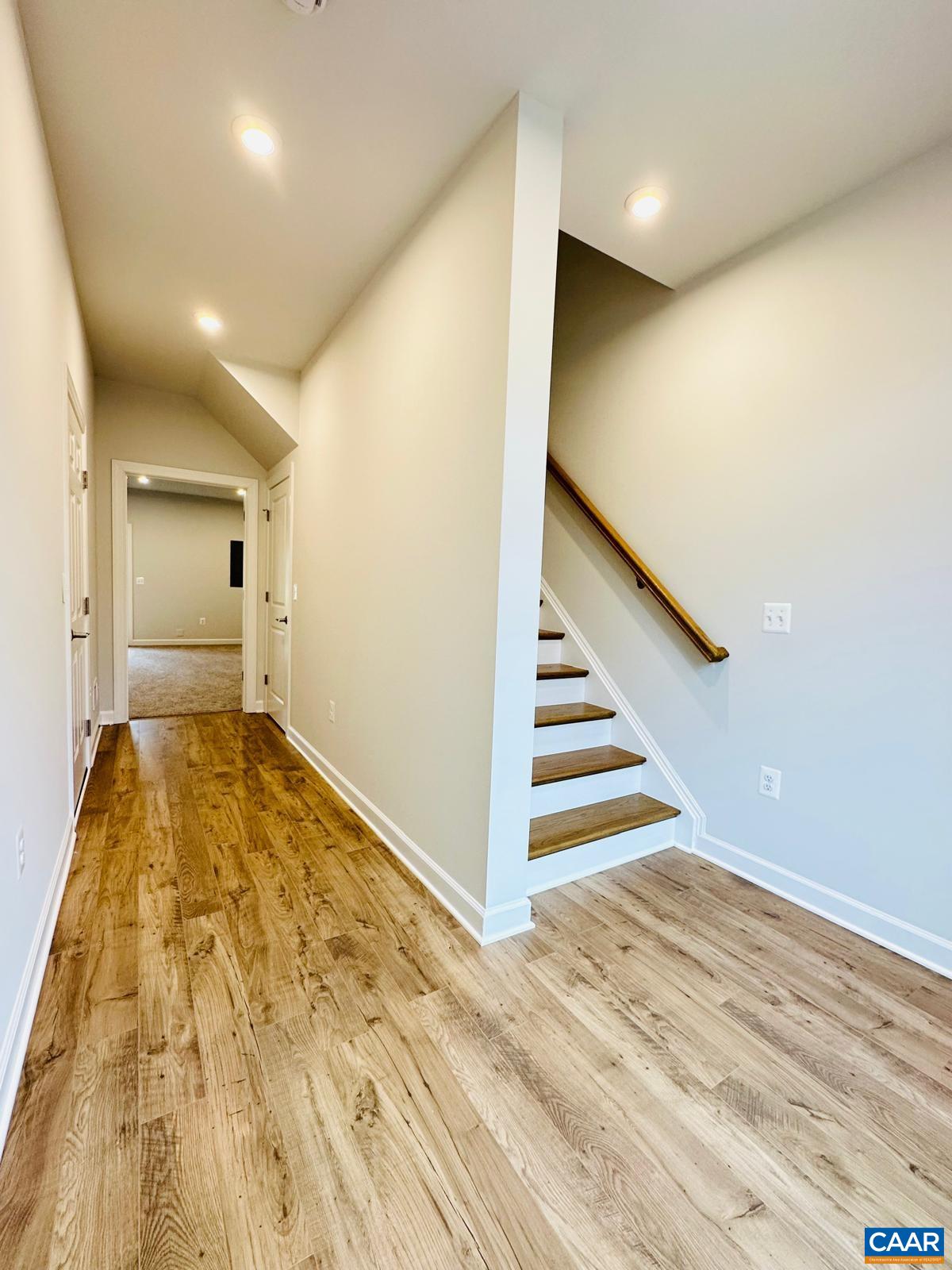3223 Horizon Road Charlottesville, VA 22902 - Photo 2 of 30 Straight down the hall is the family room with adjoining bath, storage closet on the right under the stairs, garage on the left.