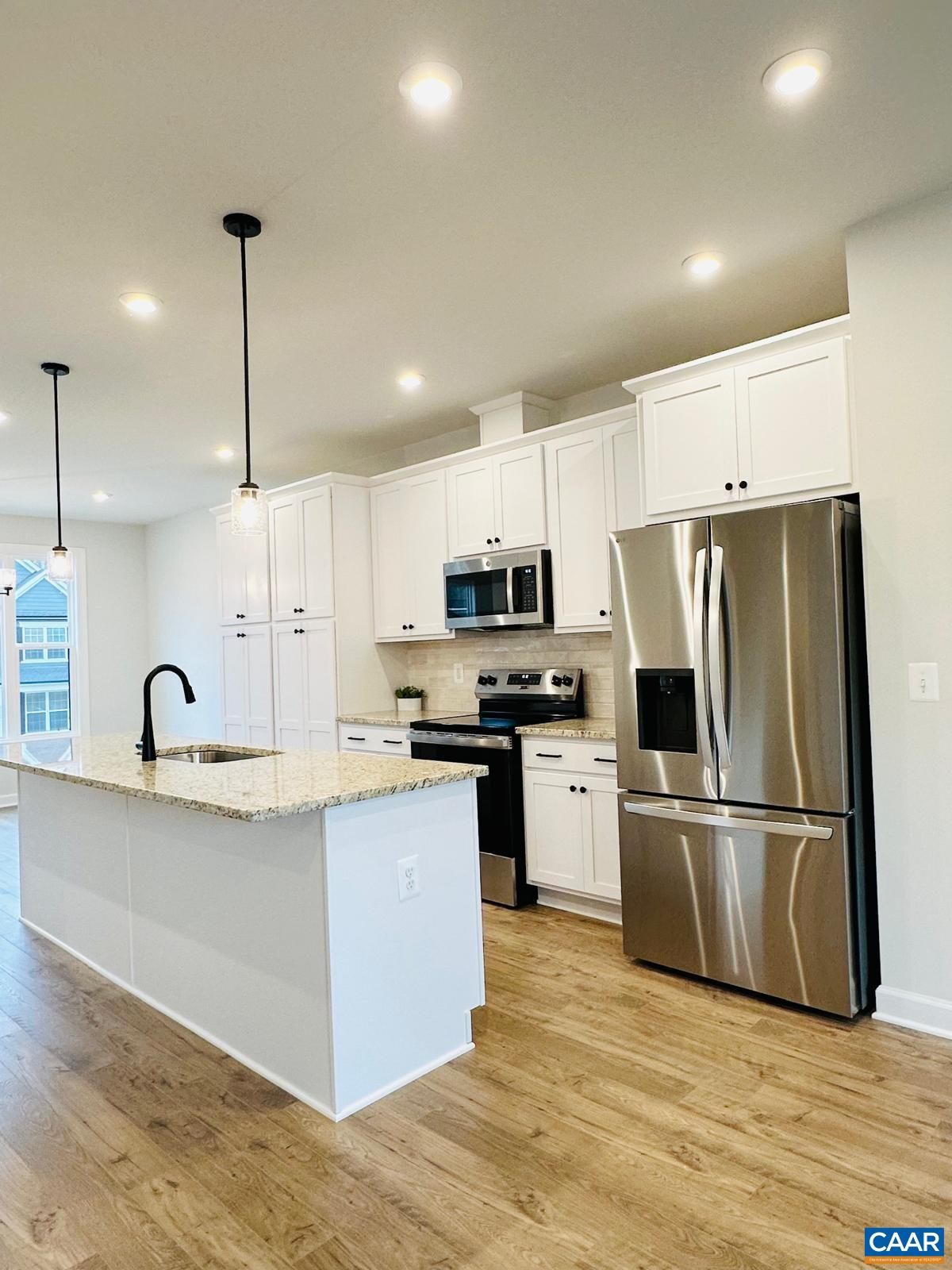 3223 Horizon Road Charlottesville, VA 22902 - Photo 5 of 30 Close up of oversized island, cabinetry, appliances