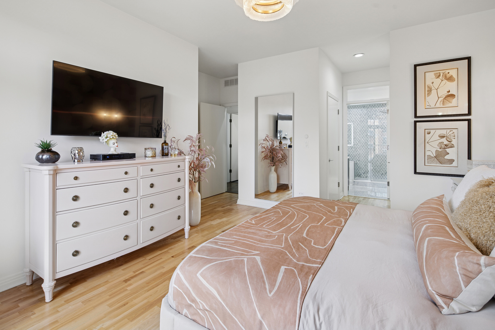 560 West Fulton Street, Unit 503 Chicago, IL 60661 - Photo 16 of 25 a bedroom with a bed and a flat screen tv