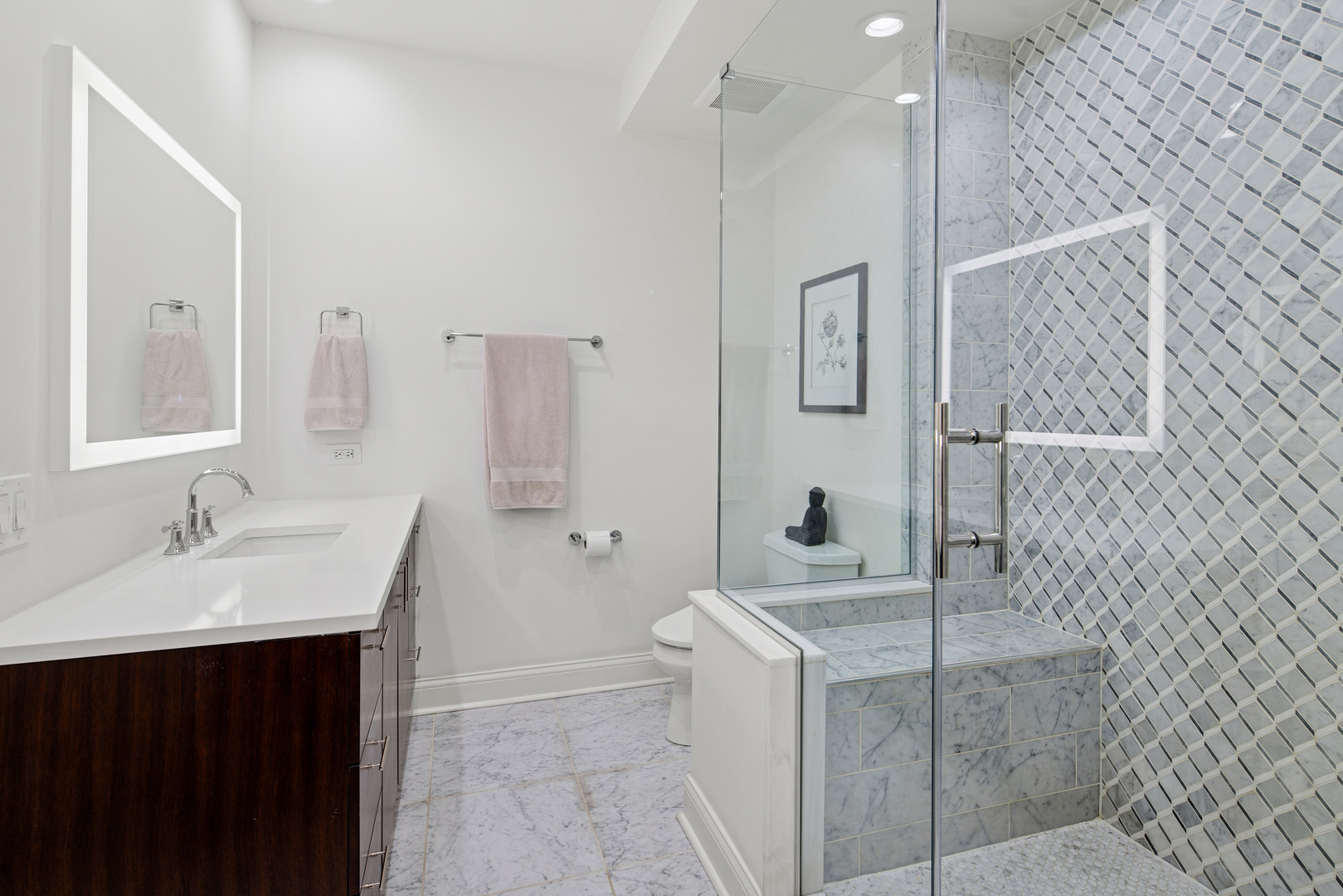 560 West Fulton Street, Unit 503 Chicago, IL 60661 - Photo 17 of 25 a bathroom with a sink and a mirror