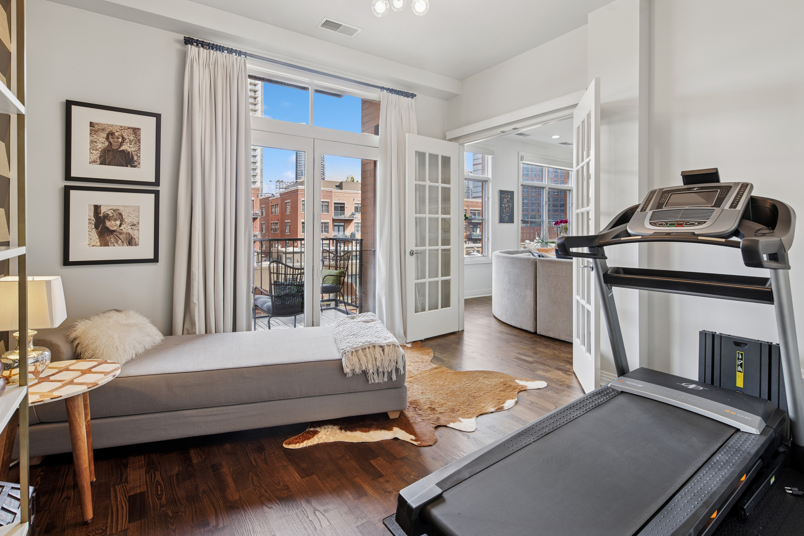 560 West Fulton Street, Unit 503 Chicago, IL 60661 - Photo 22 of 25 a bedroom with furniture and large window