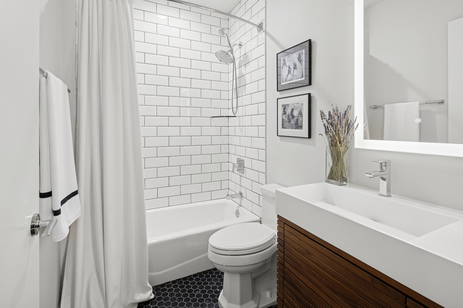 560 West Fulton Street, Unit 503 Chicago, IL 60661 - Photo 23 of 25 a bathroom with a sink toilet and shower