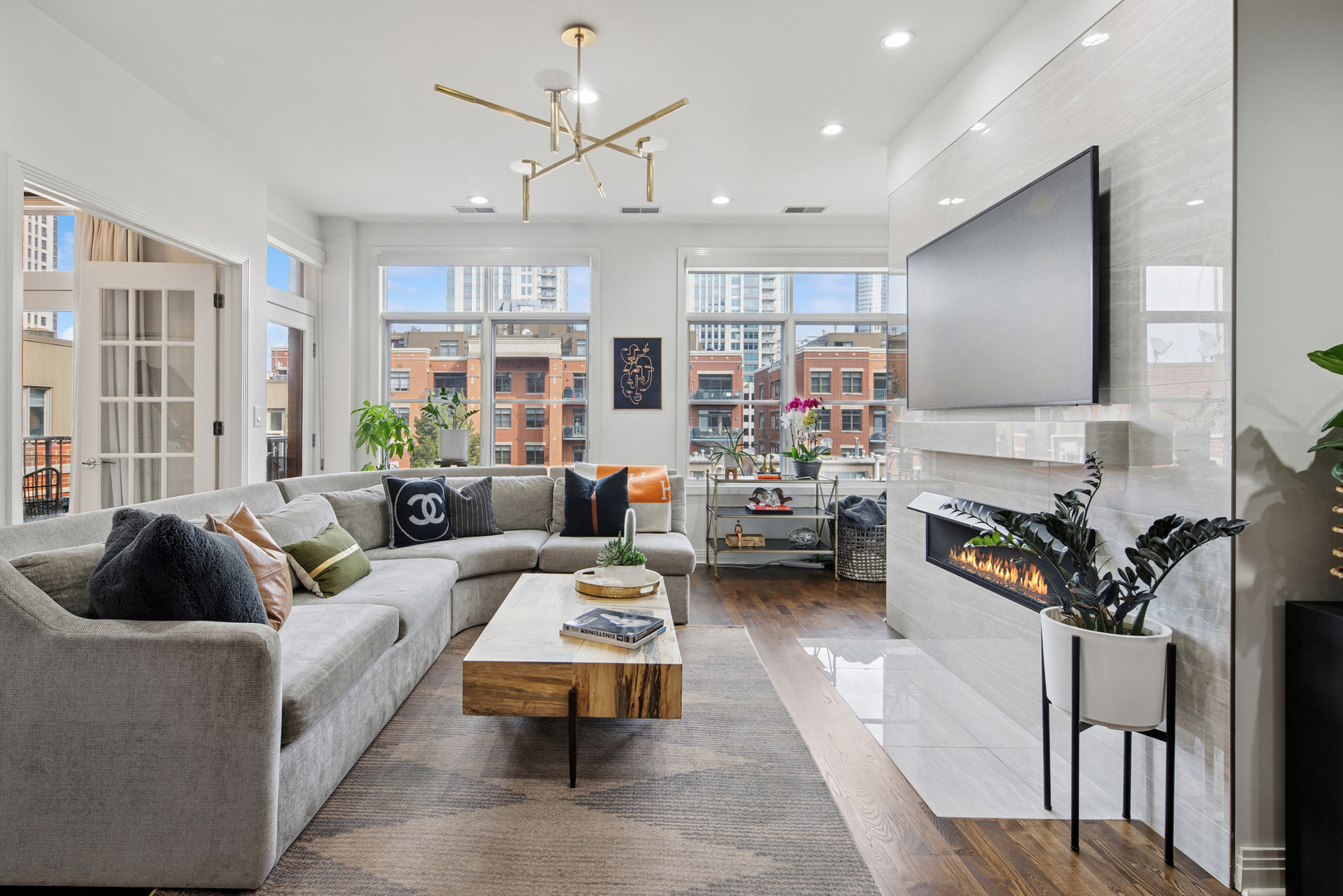 560 West Fulton Street, Unit 503 Chicago, IL 60661 - Photo 5 of 25 a living room with furniture and a fireplace