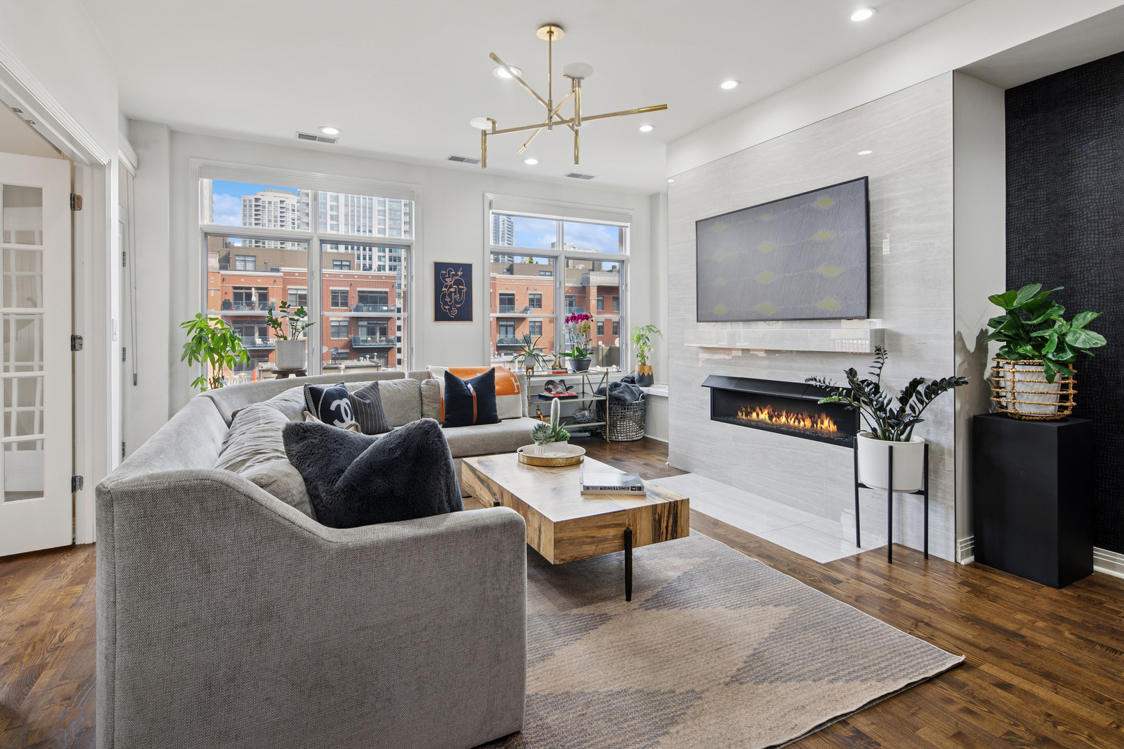 560 West Fulton Street, Unit 503 Chicago, IL 60661 - Photo 6 of 25 a living room with furniture and a flat screen tv