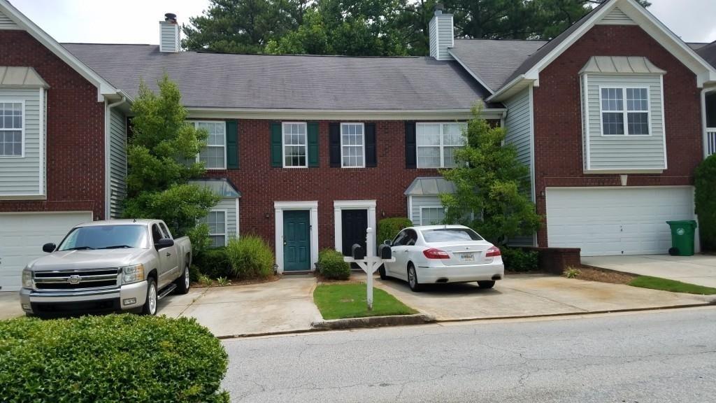 2154 Lenox Avenue Decatur, GA 30035 - Photo 1 of 1 a car parked in front of white house