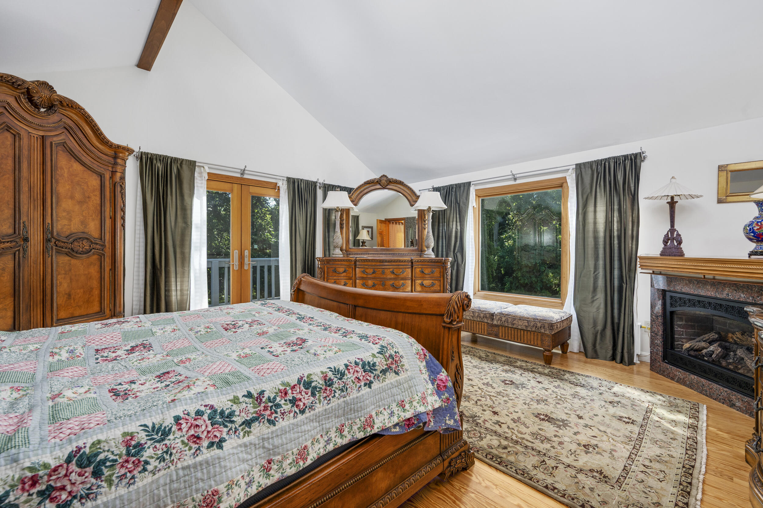 1875 State Highway Eastham, MA 02642 - Photo 22 of 69 a bedroom with a bed and a fireplace