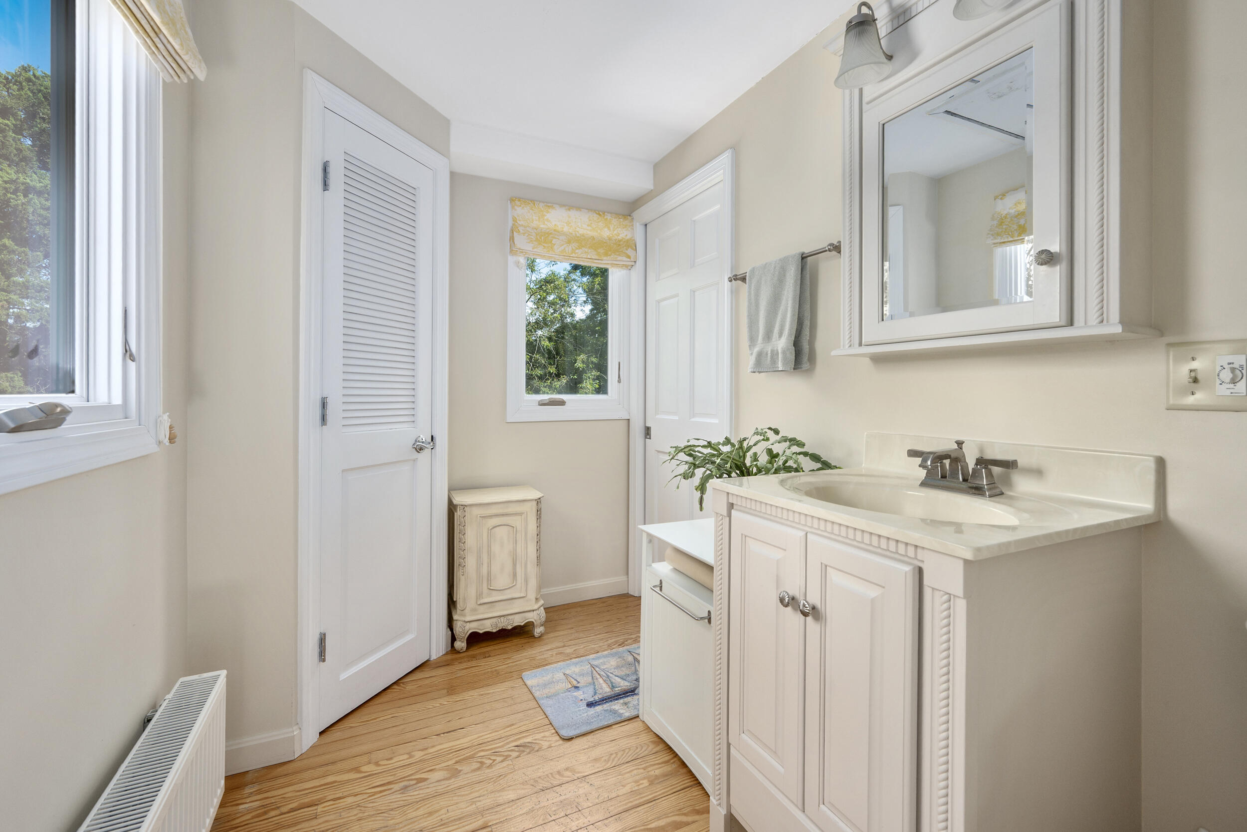 1875 State Highway Eastham, MA 02642 - Photo 32 of 69 a bathroom with a sink and a mirror