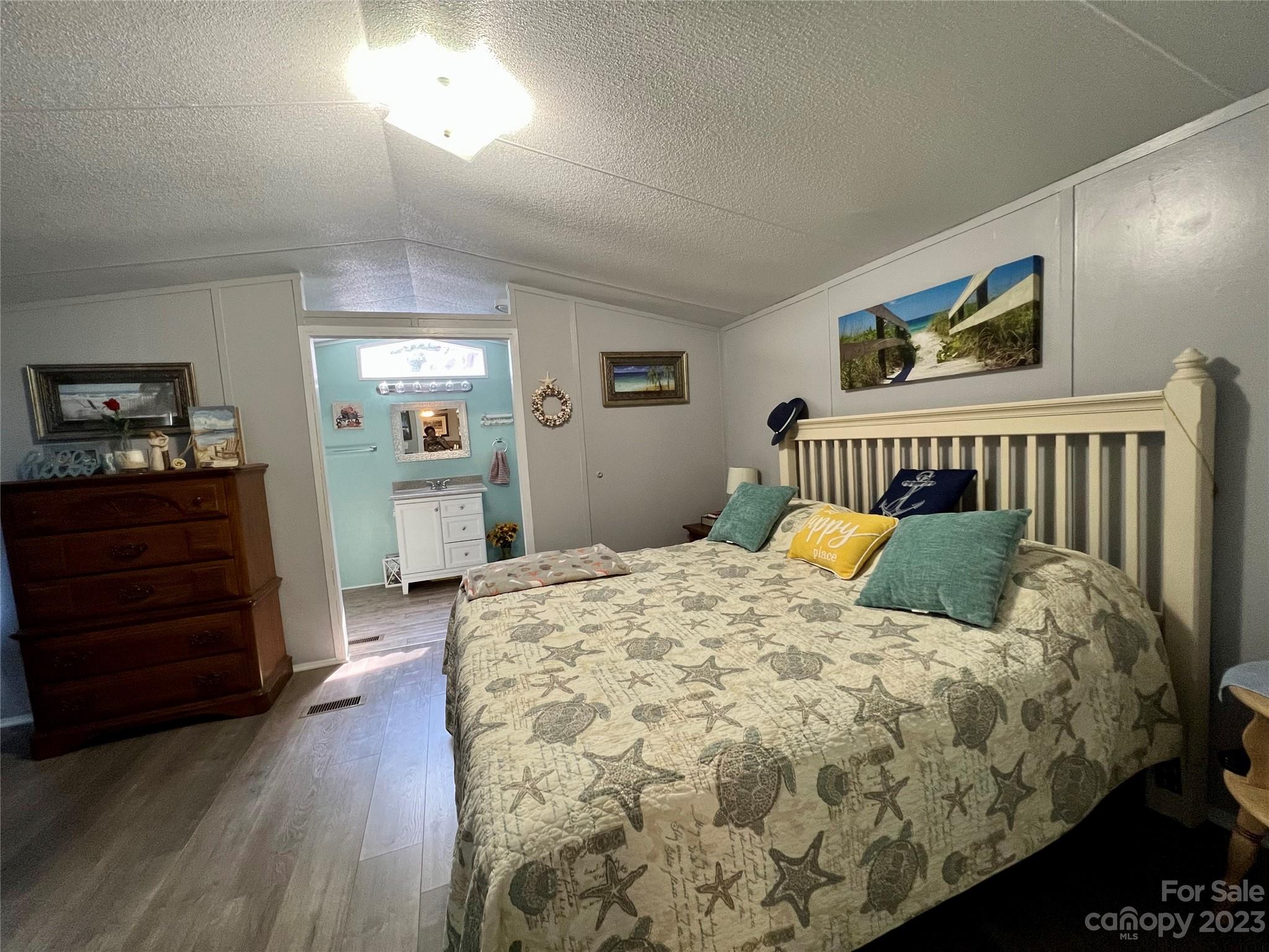 1508 Scenic View Road Hickory Grove, SC 29717 - Photo 15 of 24 a bedroom with a bed and wooden floor