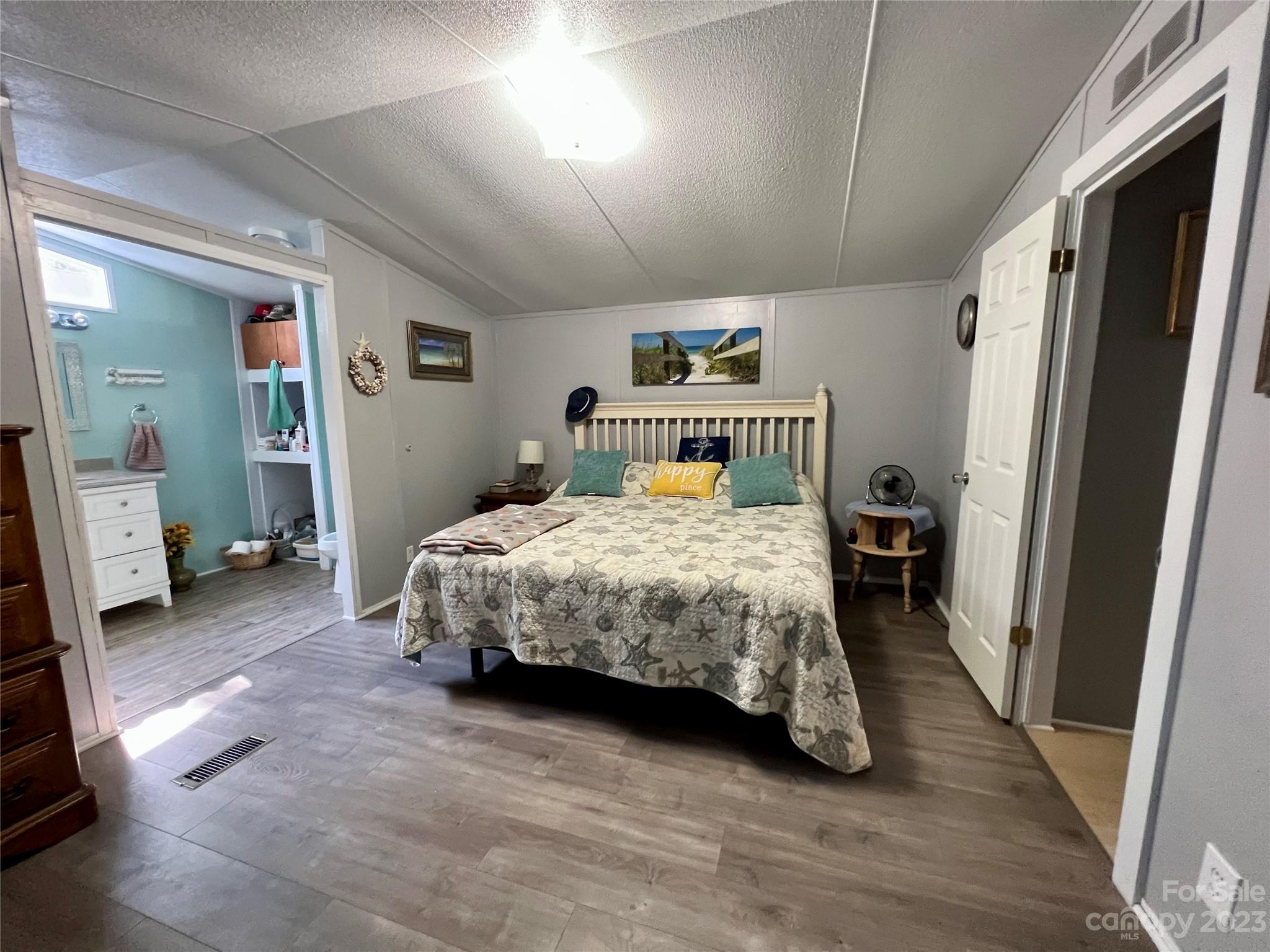 1508 Scenic View Road Hickory Grove, SC 29717 - Photo 17 of 24 a bedroom with a bed and a large mirror