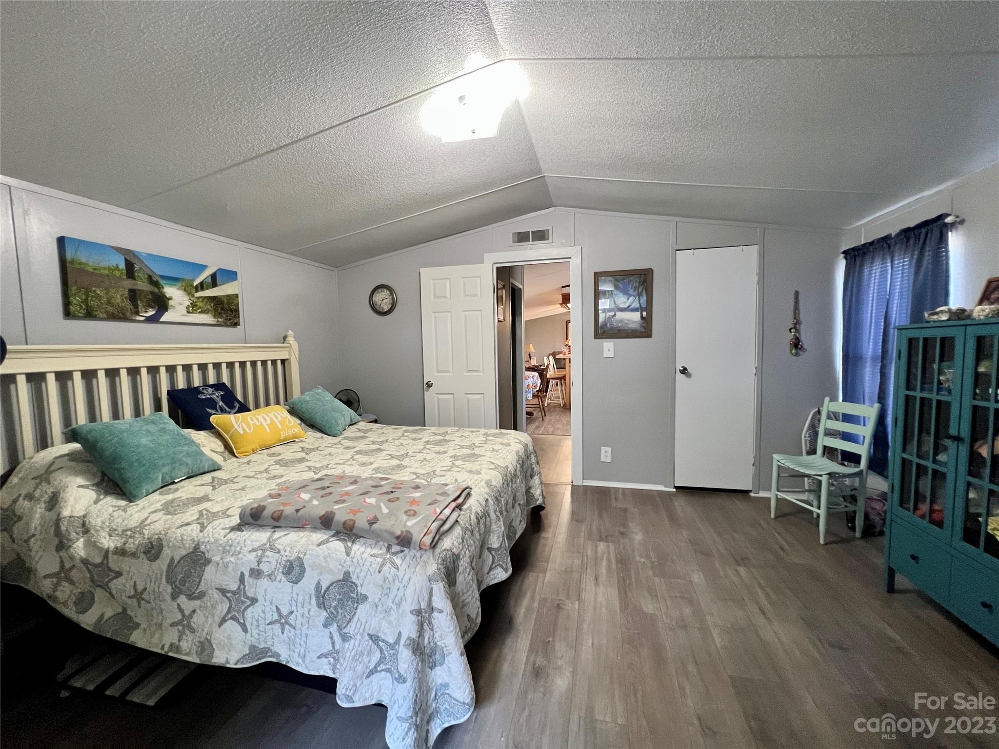 1508 Scenic View Road Hickory Grove, SC 29717 - Photo 18 of 24 a bedroom with a bed and wooden floor