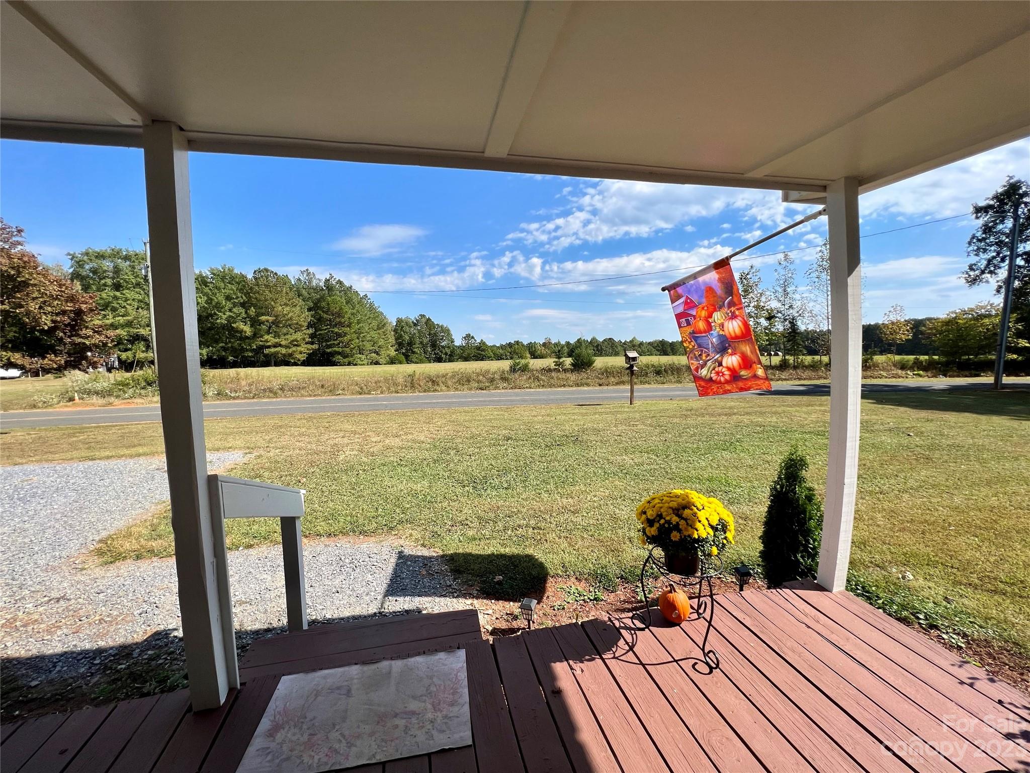 1508 Scenic View Road Hickory Grove, SC 29717 - Photo 3 of 24 a view of a balcony with chair and wooden floor