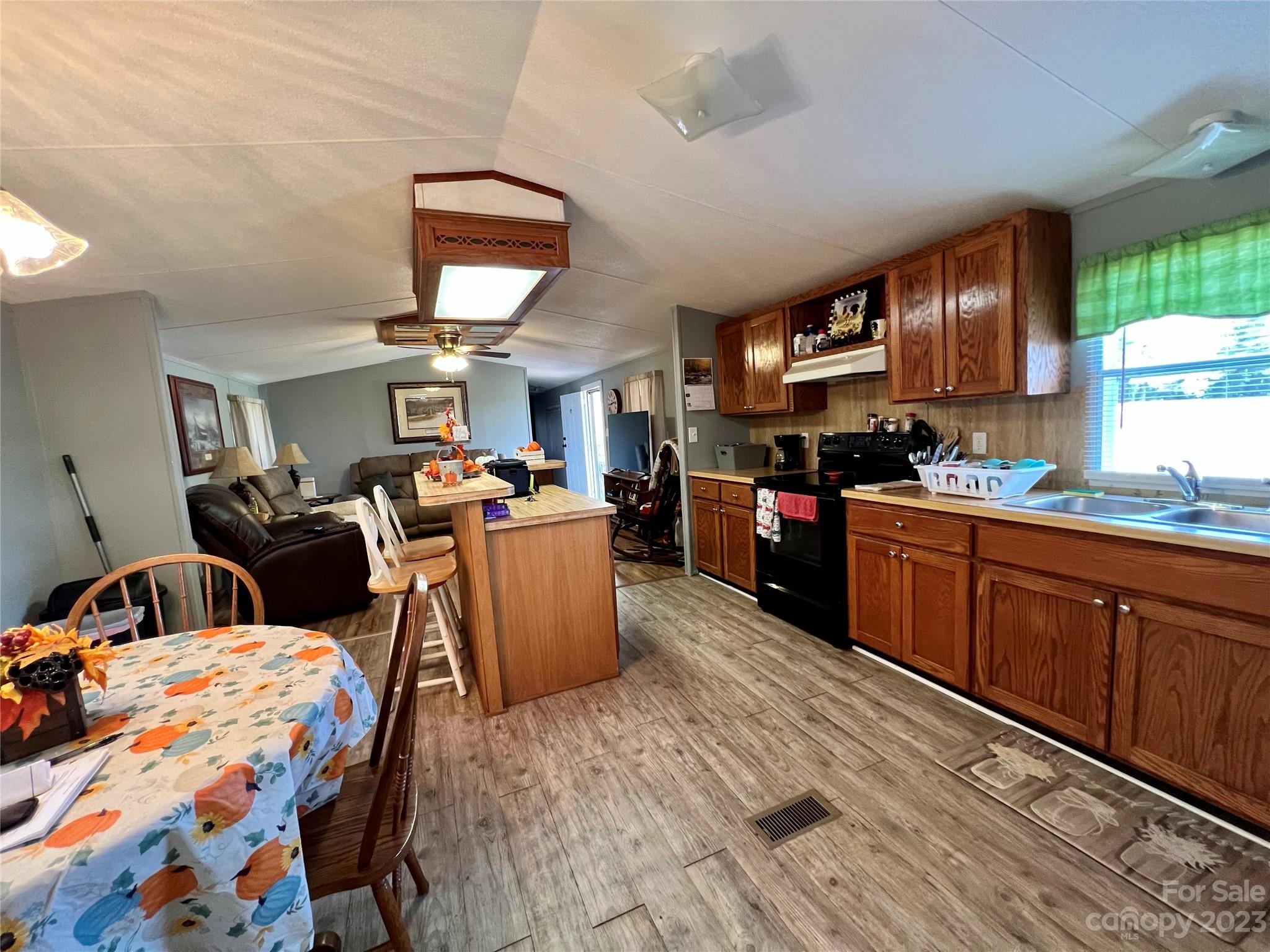 1508 Scenic View Road Hickory Grove, SC 29717 - Photo 7 of 24 a kitchen with stainless steel appliances granite countertop a sink dishwasher stove and cabinets