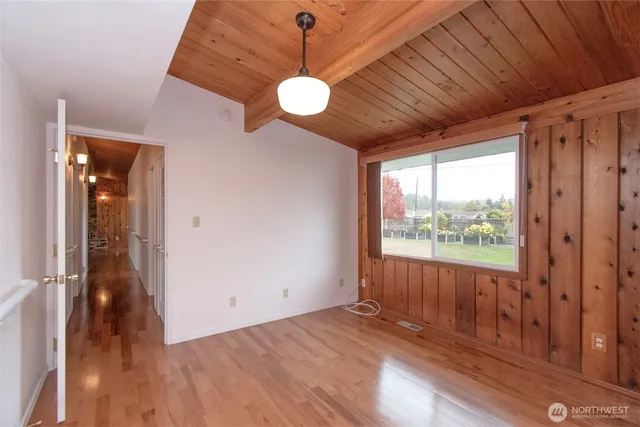 a bathroom with a sink double vanity granite and a large mirror