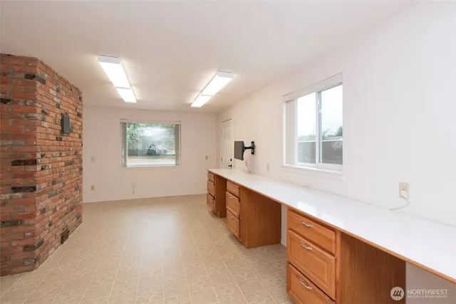 a room with furniture and flat screen tv
