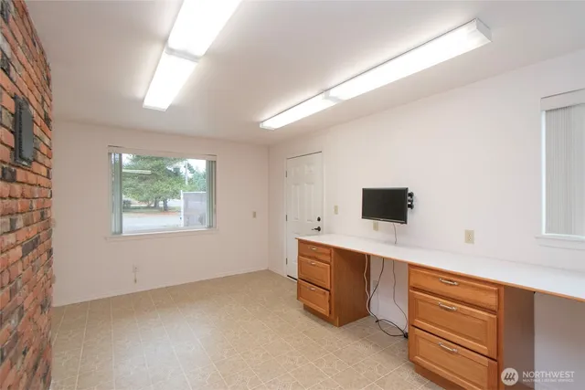 a view of a building with wooden floor and fence