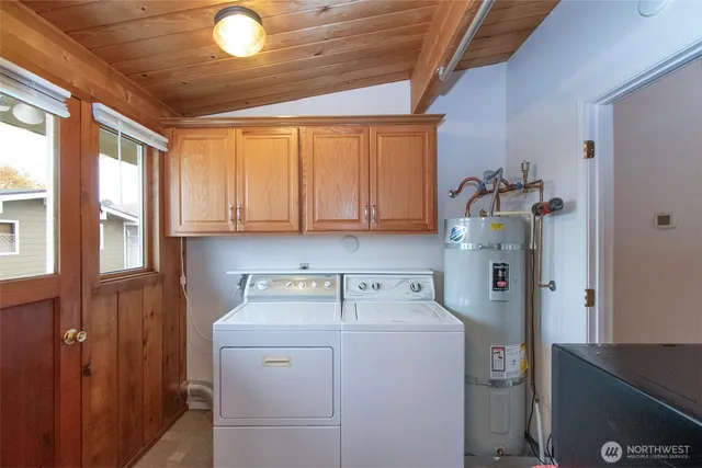 a utility room with closet dryer and washer