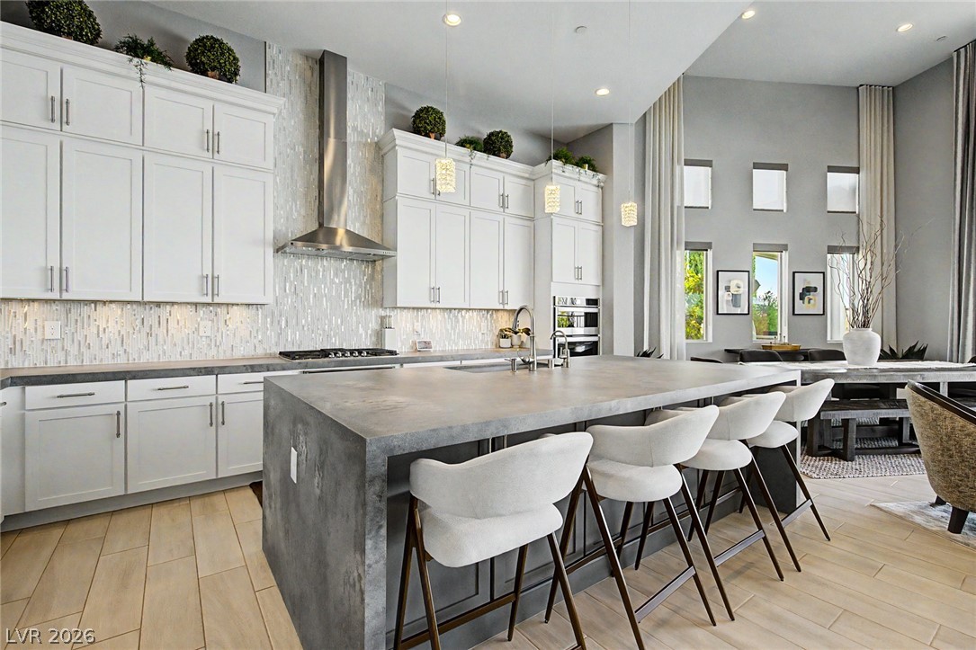 6014 Willow Ridge Court Las Vegas, NV 89135 - Photo 31 of 99 An inviting kitchen with a spacious island, perfect for gathering and culinary adventures.