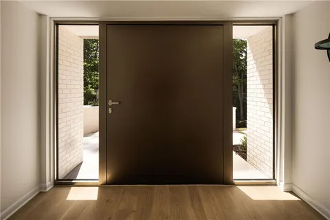 a bathroom with a sink and a large mirror