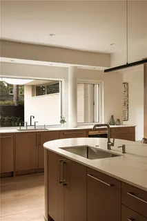 a bathroom with a double vanity sink toilet and shower
