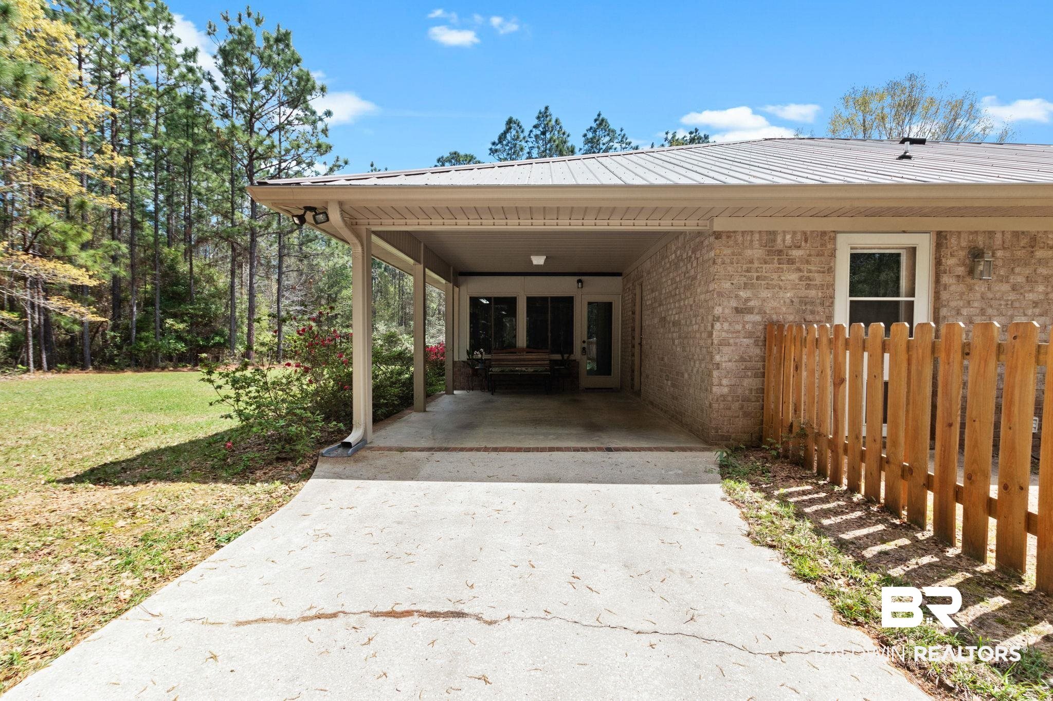 24250 Hack Road Bay Minette, AL 36507 - Photo 46 of 88 View of parking with concrete driveway and an attached carport