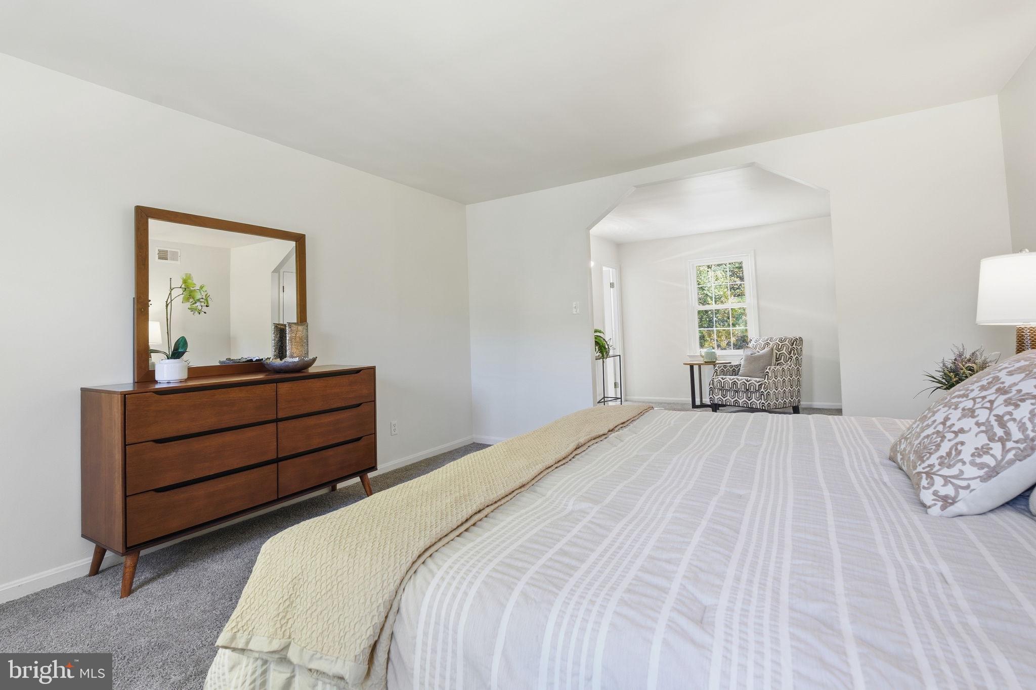15101 Redgate Drive Silver Spring, MD 20905 - Photo 24 of 39 a bedroom with a bed and a dresser