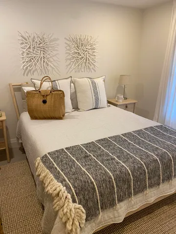 a bedroom with a bed and a couch