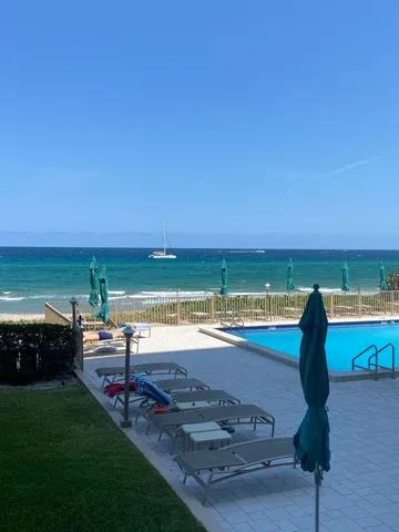 a view of a swimming pool with an ocean view