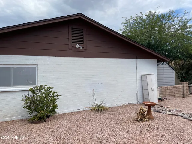 a view of backyard with seating space