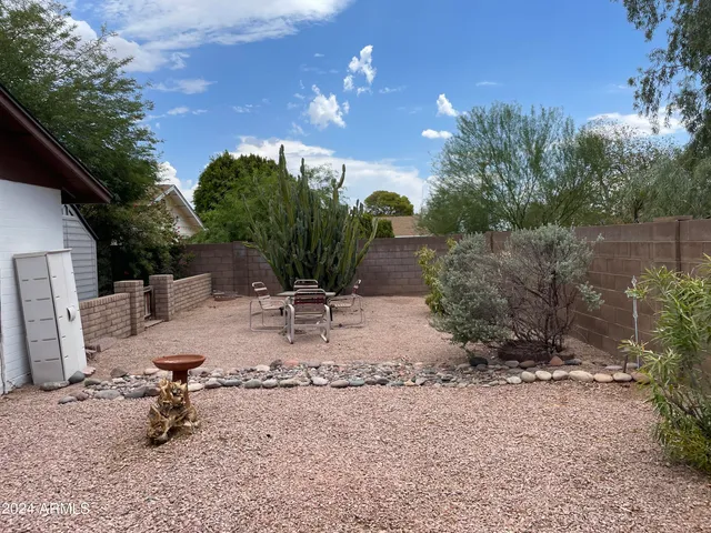 a view of a house with a tree