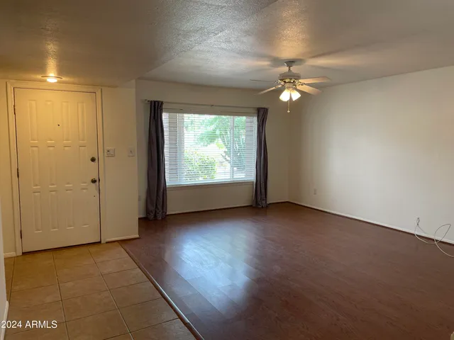 a view of a dining room with furniture and a window