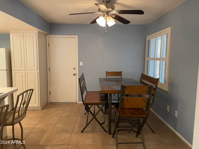 a kitchen with stainless steel appliances granite countertop a sink a stove a refrigerator and a refrigerator