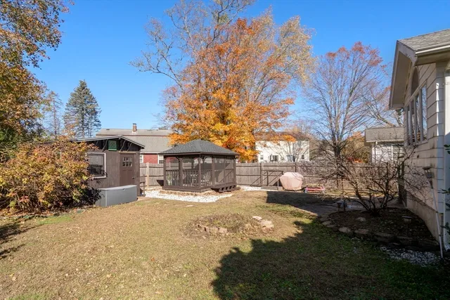 a view of a house with a yard covered with snow in front of house