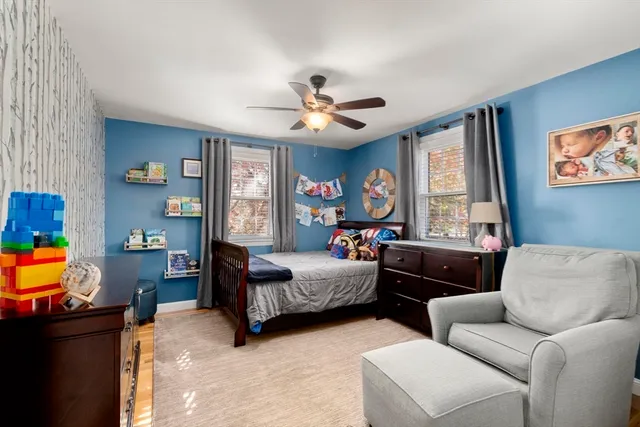 a bedroom with furniture and a window