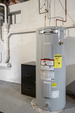 a outdoor living space with a couch and a potted plant