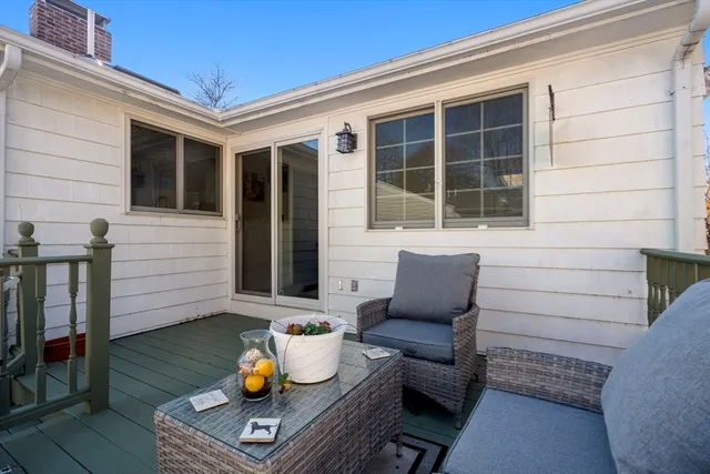 a view of house with backyard and deck