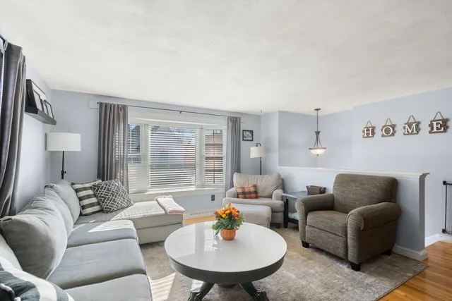 a living room with furniture and a table