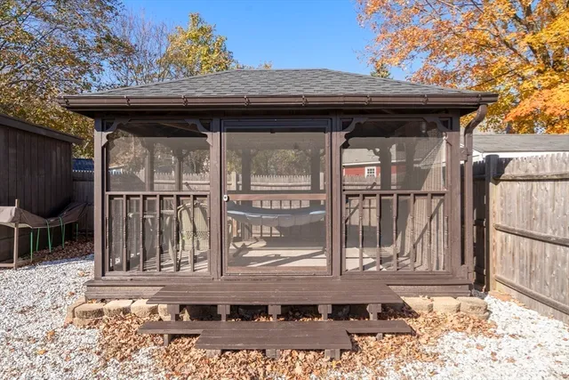 a view of a house with a yard and pathway