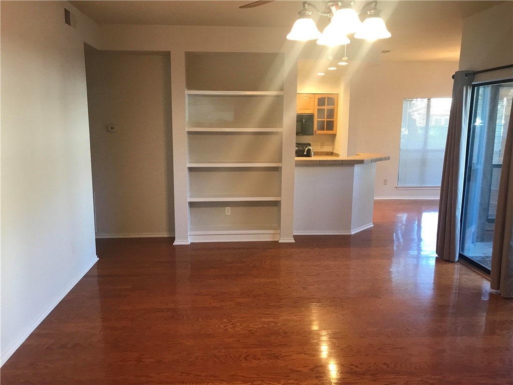4711 Spicewood Springs Road, Unit A101 Austin, TX 78759 - Photo 1 of 1 a view of a room with wooden floor and a window