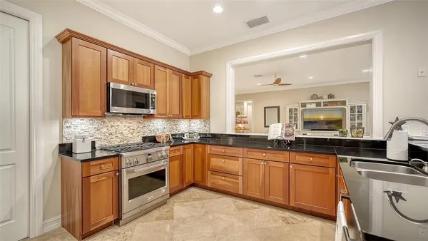 a bathroom with a toilet sink mirror and vanity
