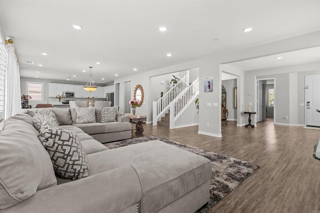 29809 Gypsy Vanner Way Menifee, CA 92584 - Photo 12 of 45 a living room with furniture and wooden floor