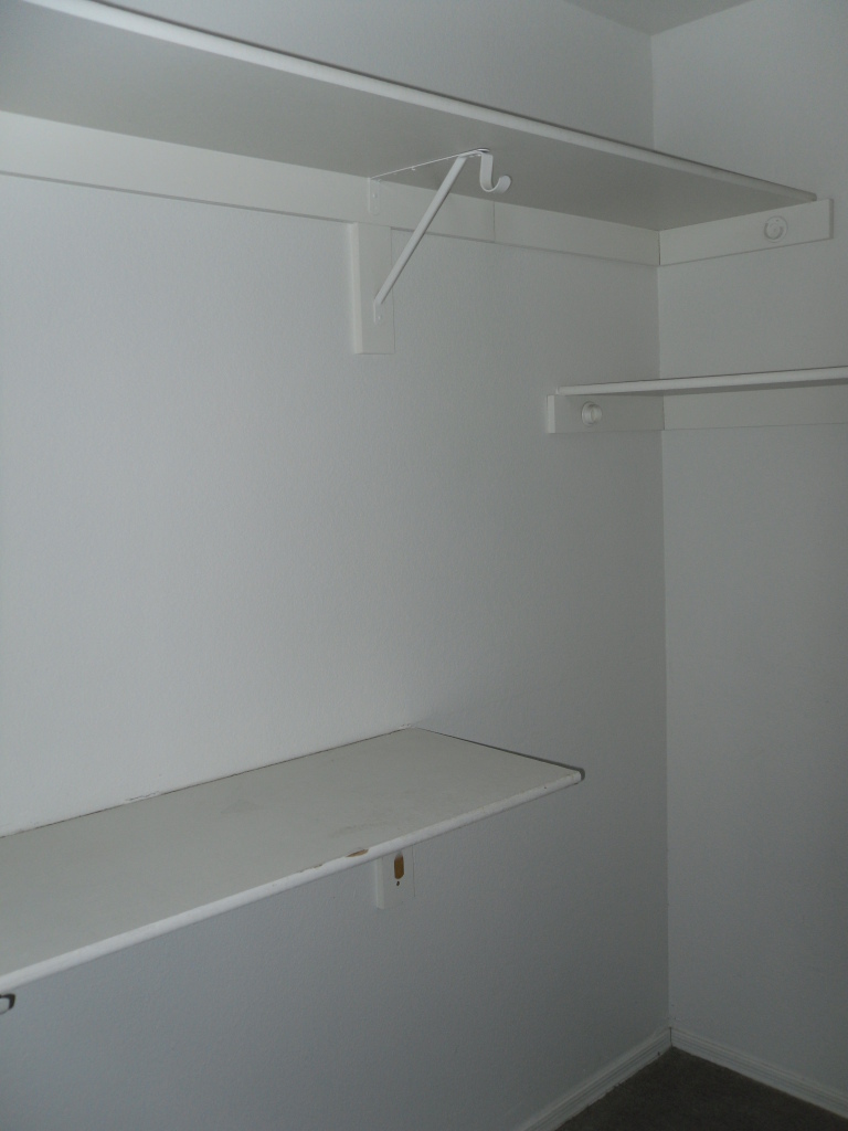1431 East Carson Road Phoenix, AZ 85042 - Photo 12 of 25 a view of a room with racks on the wall