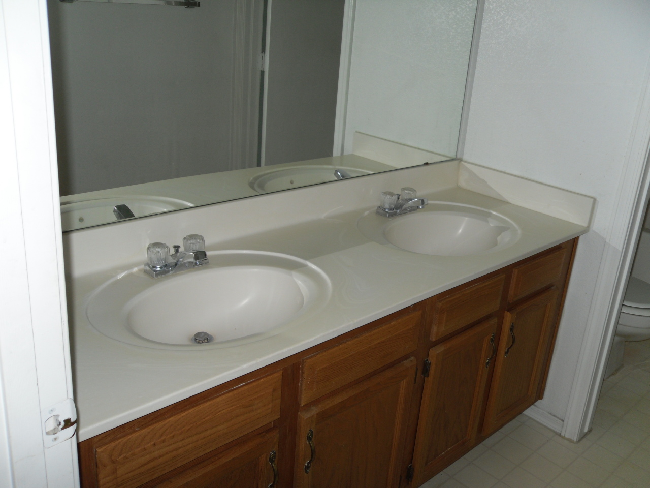 1431 East Carson Road Phoenix, AZ 85042 - Photo 18 of 25 a bathroom with a sink and a mirror